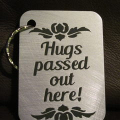 Keychain Hugs Passed Out Here
